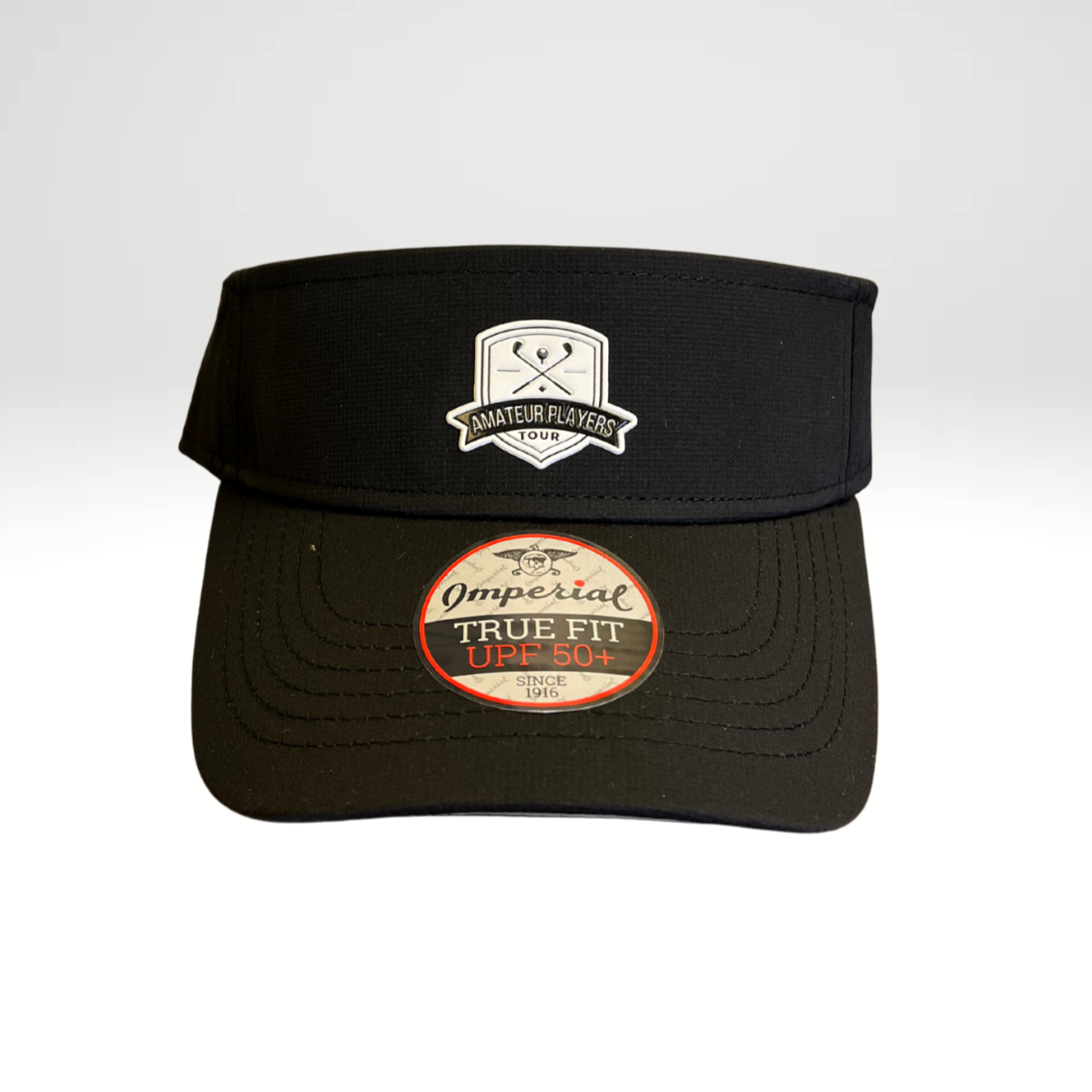 A black performance visor with a low profile crown and a micro hook & loop elastic loop closure.